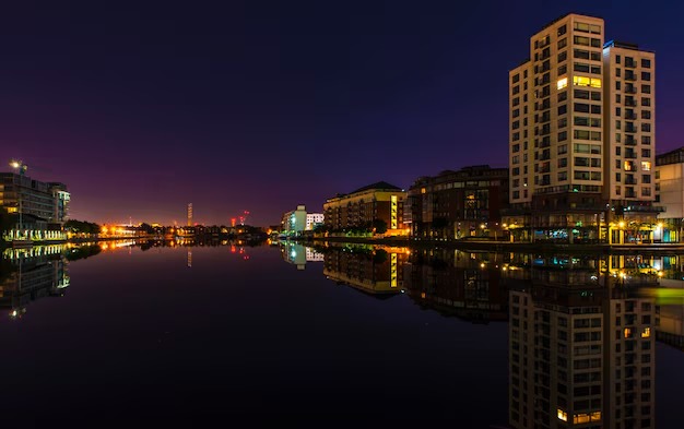 imgi 4 illuminated buildings reflecting lake against clear sky dusk 1048944 27916649